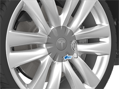 一个从轮毂螺母工具指向轮毂螺母罩上的孔的箭头